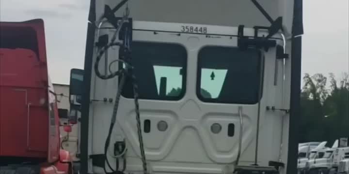Semi trucks parked in a trucking yard